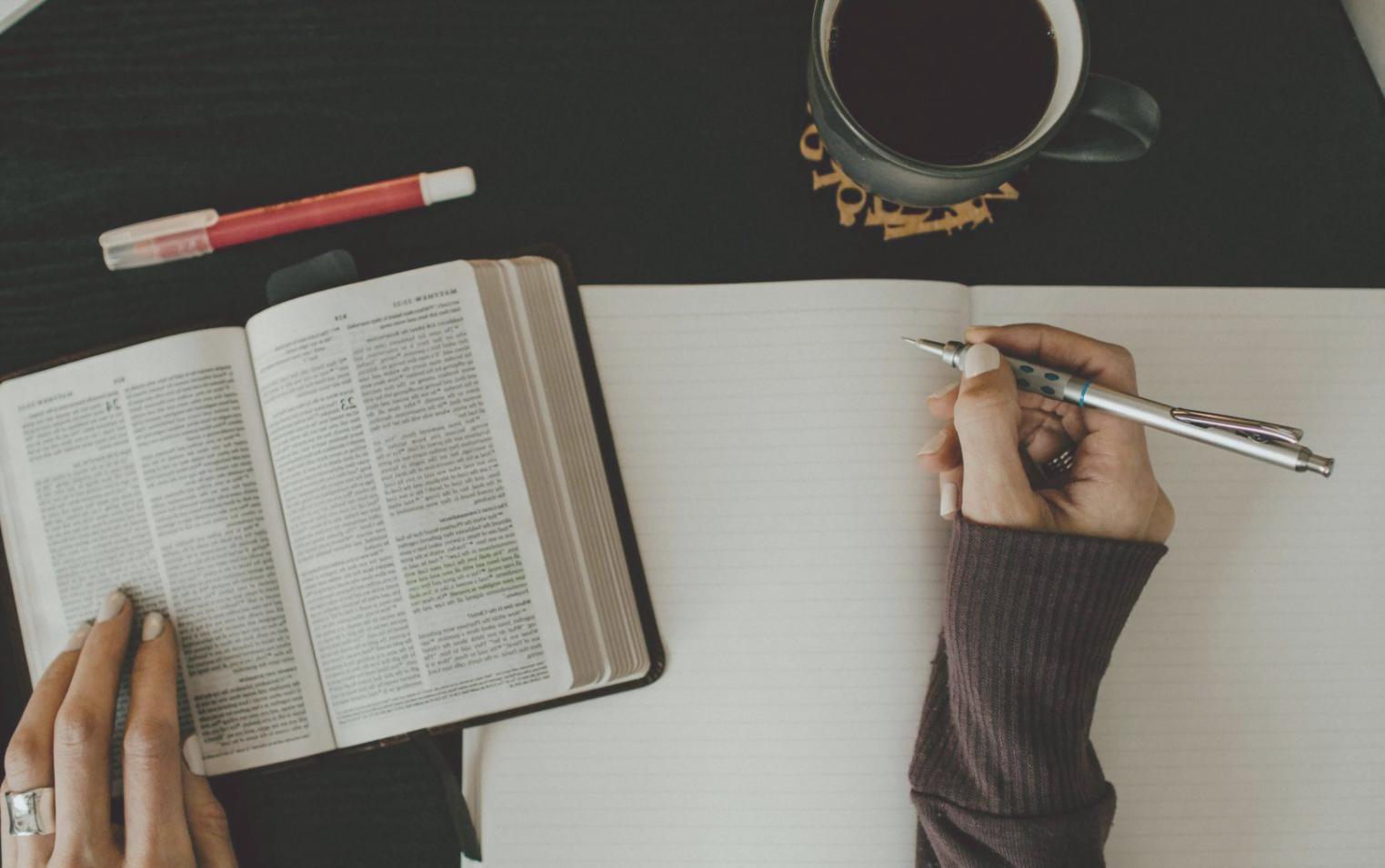 Person reviewing financial documents with weekly planning calendar